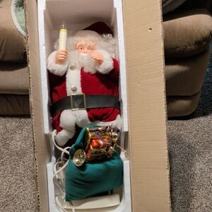 Festive Santa Claus Figure with Light And Dance's And Music.